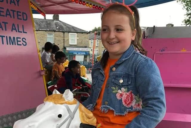 A carousel ride was just the ticket for this young lady at the community fun day.