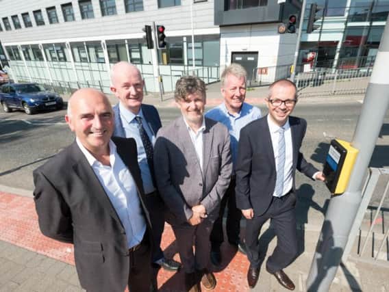At the new 'countdown' pedestrian crossing outside Burnley College, Graham Cowley, chair of LEP Growth Deal Management Board, John Gatheral and Martin Porter, LCC highways design team, Coun. Mark Townsend, leader of Burnley Council, County Coun. Aidy Riggott, LCC lead member for economic development and cultural services.