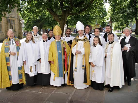 Stephen Large (fourth from left) with the Bishop of Burnley (seventh from right) at the ordaining.