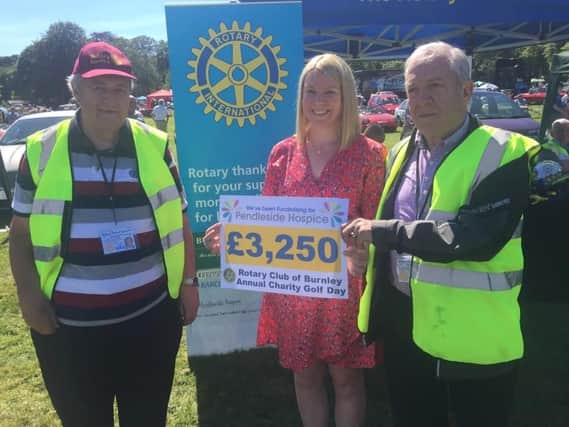 Donald George and Neil Beecham from the Rotary Club of Burnley with Pendleside Hospice trustee Nicola Alden