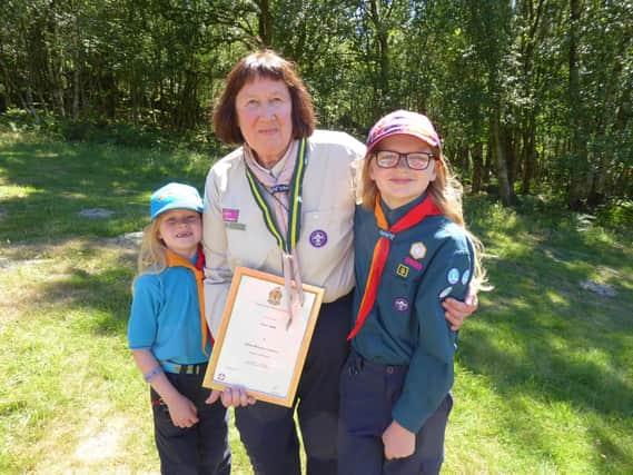 Jill with her proud grandchildren Isla (10), Scout, and Niamh (6) Beaver Scout