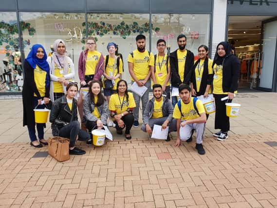 Students from Thomas Whitham Sixth Form collect money for Pendleside Hospice.