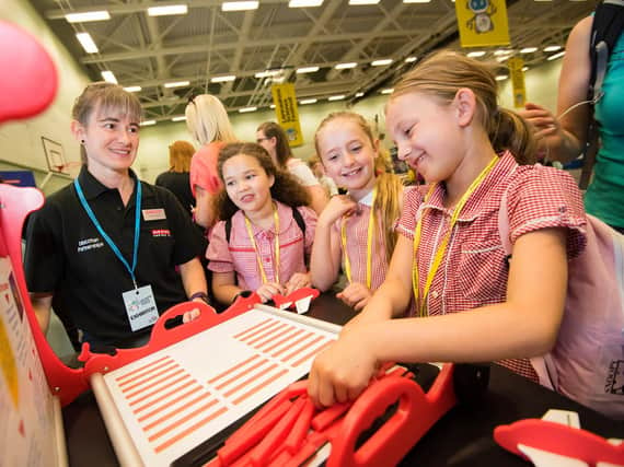 Girls from Sabden Primary School getting hands on with the technology exhibits.