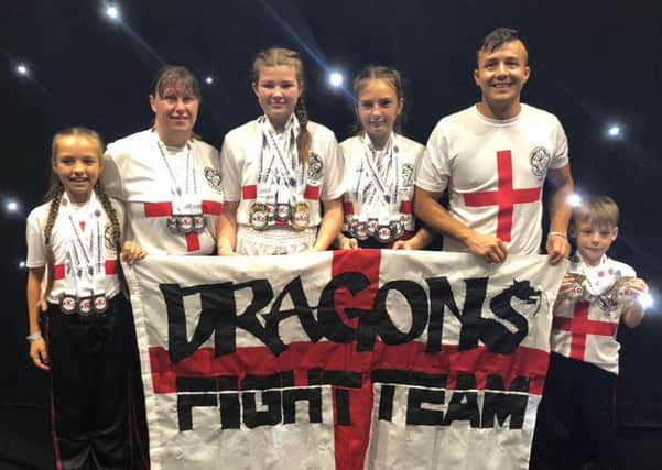 Burnleys Dragons show off their medals from the WKO World Kickboxing Championships