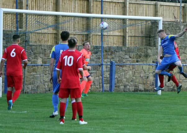 Action from Padiham's victory over Barnoldswick Town