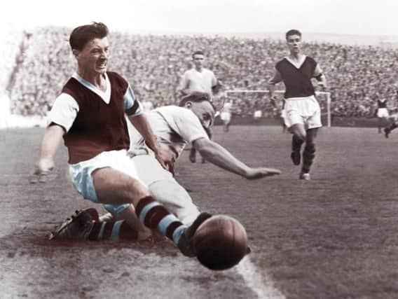 Jimmy McIlroy in action for Burnley