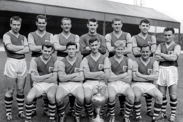 Jimmy McIlroy (centre left, front row) with the Burnley team which won the First Division title in dramatic fashion in the 1959-60 season