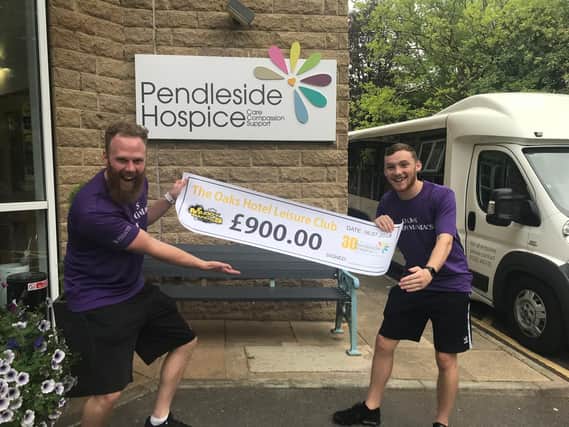 Jacob Cariou and Phil Riley from The Oaks Hotel present their cheque to Pendleside Hospice.