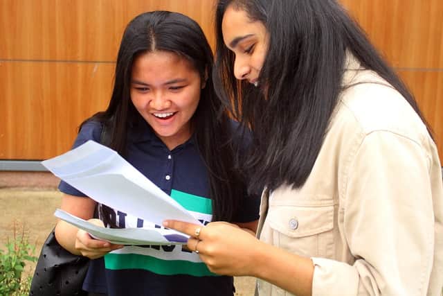 The smiles of Lora Sarte and Aishah Aslam are captured as they open their GCSE results.