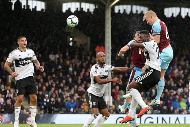 Ben Mee heads towards goal