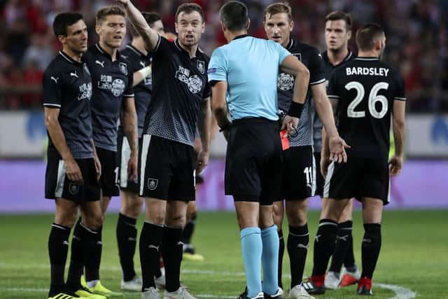 Ashley Barnes and his Burnley FC teammates remonstrate with the referee during the Clarets' 3-1 loss to Olympiakos.