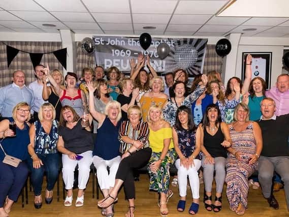 The class of 1969 from Burnley's St John the Baptist RC Primary School celebrate at their reunion.