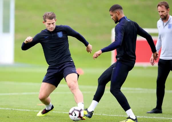 England's Ruben Loftus-Cheek (right) and James Tarkowski battle for the ball during the training session at St Georges' Park, Burton. PRESS ASSOCIATION Photo. Picture date: Sunday September 9, 2018. See PA story SOCCER England. Photo credit should read: Nigel French/PA Wire. RESTRICTIONS: Use subject to FA restrictions. Editorial use only. Commercial use only with prior written consent of the FA. No editing except cropping.
