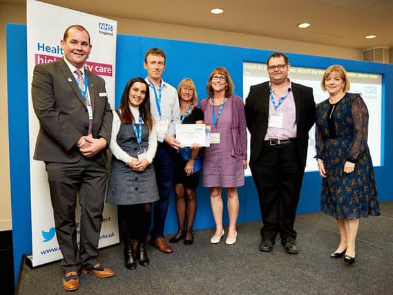 Chris Pointon (left) presents the Kate Granger Award for Compassionate Care to Jodie Bracewell, consultant anaesthetist Dr Mike Pollard, midwife Elaine Goldsworthy, consultant obstetrician Mrs Liz Martindale and Dr Adam Brook