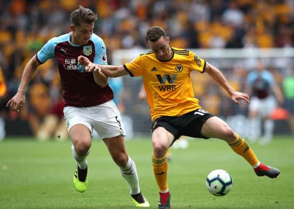Burnley's James Tarkowski (left) and Wolverhampton Wanderers' Diogo Jota battle for the ball during the Premier League match at Molineux, Wolverhampton. PRESS ASSOCIATION Photo. Picture date: Sunday September 16, 2018. See PA story SOCCER Wolves. Photo credit should read: Nick Potts/PA Wire. RESTRICTIONS: EDITORIAL USE ONLY No use with unauthorised audio, video, data, fixture lists, club/league logos or "live" services. Online in-match use limited to 120 images, no video emulation. No use in betting, games or single club/league/player publications.