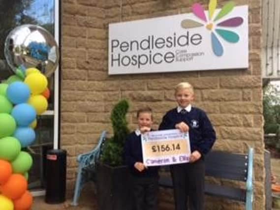 Cameron Green (right) and his brother Ellis were presented with a Certificate of Appreciation for raising 156 for Pendleside Hospice.