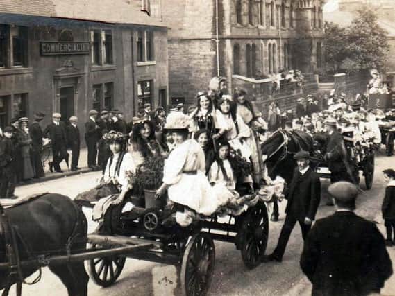 The Rose Queen parade in Church Street, Padiham, is one of the photographs to appear in the town's annual archive exhibition.