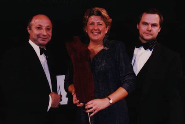 Hilary is presented with the Industry Oscar for Independent Retailer of the Year by comedian Jack Dee.