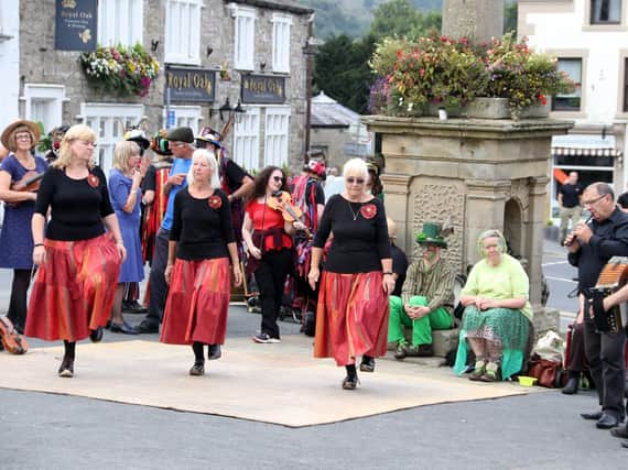 Members of the Malkin Morris group perform the art of clog dancing in Settle.