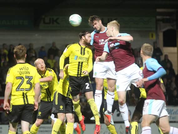Defender Kevin Long gives the Clarets the lead at the Pirelli Stadium.
