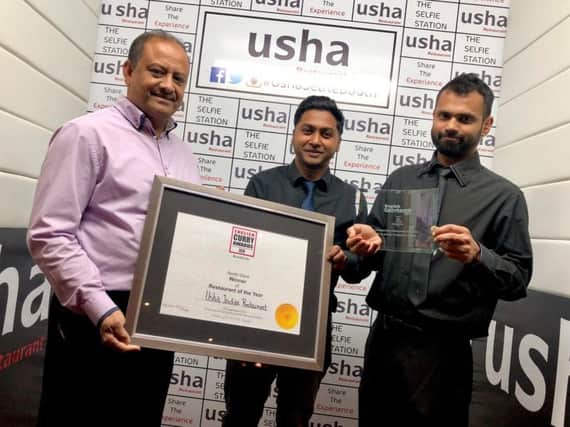 Sadar Uddin, Faz Ahmed and Alkas Ali with the certificate from the English Curry Awards.