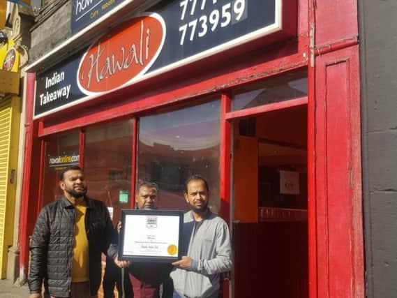 Emdad Chowdury, Shipare Ahmed and Miah Jahid with the award for North West Takeaway and Home Delivery of the Year