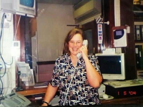 Julie at work on the reception at Gannow Baths, Burnley in the 1990s