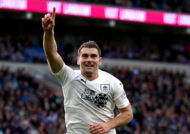 Burnley's Sam Vokes celebrates scoring his side's second goal of the game during the Premier League match at the Cardiff City Stadium. PRESS ASSOCIATION Photo. Picture date: Sunday September 30, 2018. See PA story SOCCER Cardiff. Photo credit should read: Nick Potts/PA Wire. RESTRICTIONS: EDITORIAL USE ONLY No use with unauthorised audio, video, data, fixture lists, club/league logos or "live" services. Online in-match use limited to 120 images, no video emulation. No use in betting, games or single club/league/player publications.