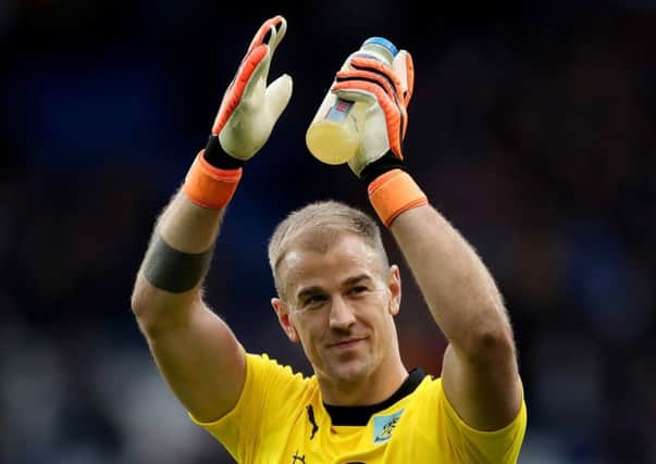 Burnley goalkeeper Joe Hart celebrates after the final whistle during the Premier League match at the Cardiff City Stadium. PRESS ASSOCIATION Photo. Picture date: Sunday September 30, 2018. See PA story SOCCER Cardiff. Photo credit should read: Nick Potts/PA Wire. RESTRICTIONS: EDITORIAL USE ONLY No use with unauthorised audio, video, data, fixture lists, club/league logos or "live" services. Online in-match use limited to 120 images, no video emulation. No use in betting, games or single club/league/player publications.