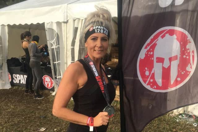 Lisa prepares to overcome her fear of heights to conquer the Spartan Race obstacle course