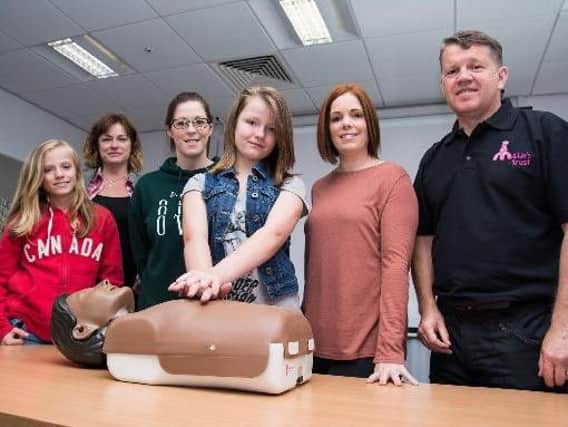 Millie's Trust first aider Barrie Sutcliffe puts volunteers through their paces at a family first aid course held in at Burnley Fire Station last year.