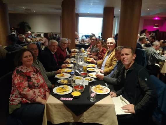Guests enjoying a meal at the charity curry night held at Usha