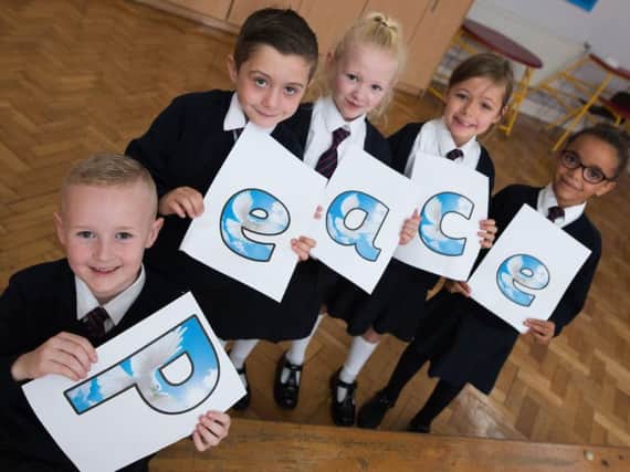 Give peace a chance is the appeal from these pupils at Burnley's St Augustine's RC Primary School.