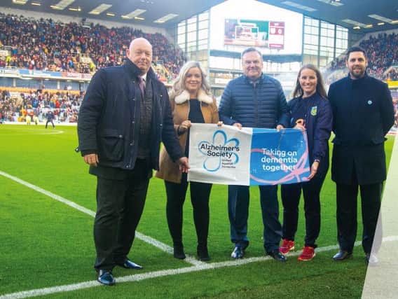 Burnley FCs Chief Executive Officer Dave Baldwin, Amy Blackburn Alzheimers Society Community Fundraiser, Burnley FC Chairman Mike Garlick, Burnley FC in the Community Head of Health and Wellbeing Abby Turner and Burnley FC in the Community Chief Executive Officer Neil Hart.