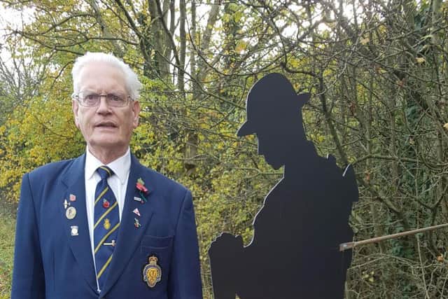Ken poses with one of the soldier silhouettes at the family spotted at on the A671.