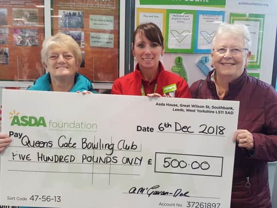 Jean Sharples, Annette McGowan-Doe, and Doreen Jowett at a cheque presentation in aid of Queensgate Bowling Club, Burnley.