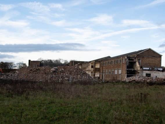 The old Habergham Sixth Form building in Burnley is being brought down to make way for a housing development