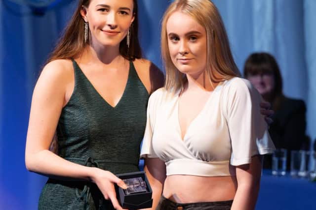 Madison Emmett receives her award from Chloe Wilkinson.