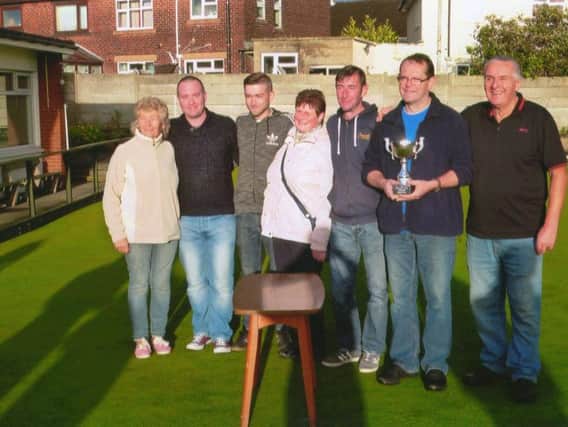 Lee Sharples (holding the trophy) was the winner of the St Andrew's Bowling Club fundraising tournament