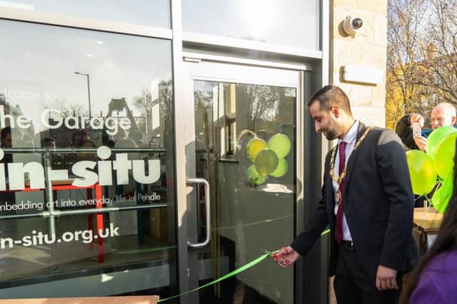 Coun. Shazad Aslam, the Mayor of Brierfield, cutting the ribbon at The Garage during a public launch. (s)
