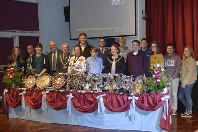The civic dignitaries who attended the awards with headteacher Mr Michael Wright and some of the students.
