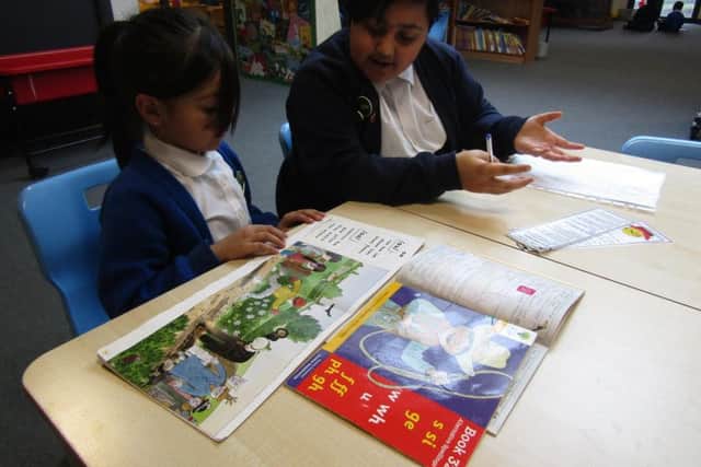 One of the Year 6 students with her Reading Buddy.