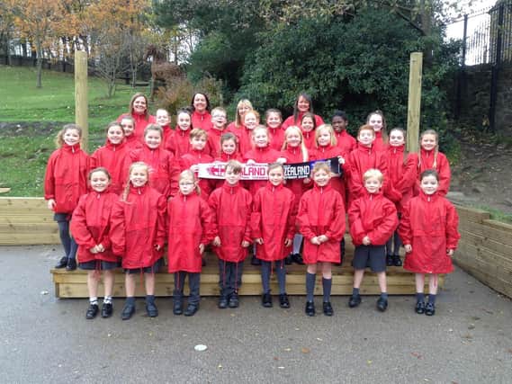 The choir from St John the Divine Primary School, Cliviger who sang at a recent international rugby competition between England and New Zealand.