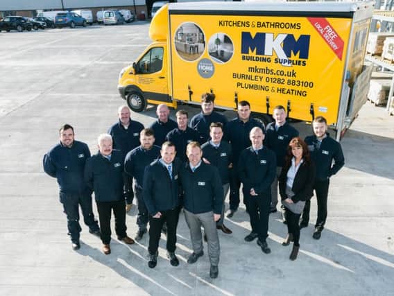 Staff at the newly opened MKM builders'merchants in Burnley which has created 15 jobs.