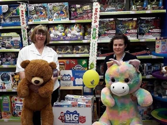 Captain Maisie Veacock (left) of the Burnley Salvation Army with Kirsty Hill, assistant manager at  The Entertainer in Burnley which is supporting the annual Christmas Toy Appeal.
