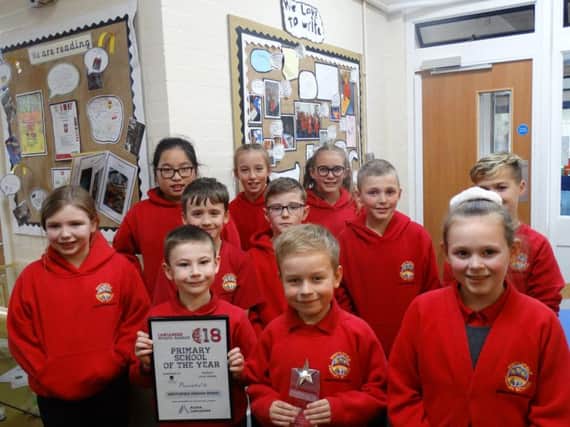 Students from Whittlefield Primary School in Burnley celebrate being highly commended in the Lancashire Sports Awards.