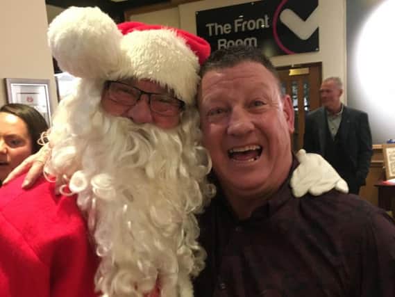 Birthday boy Gary Scully was thrilled to greet Father Christmas, aka Brian Crossley to his 50th party.