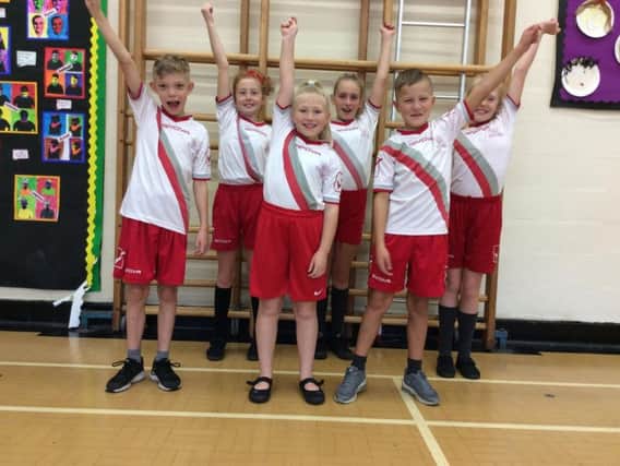 Students from Earby Springfield Primary School celebrate their sports award.