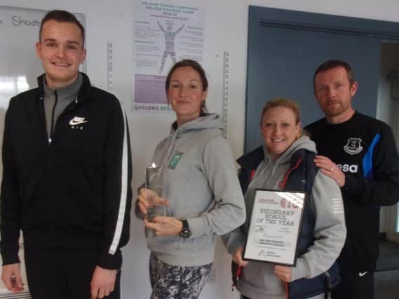 PE staff at Sir John Thursby Community College (from left to right) Andrew Hill, Heather Windle, Liz Broomhead and Danny Wilson with the accolades they brought home from the Lancashire Sports Awards.