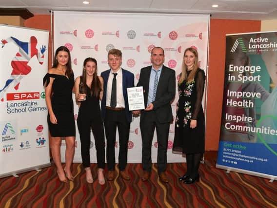 Pictured representing Clayton Harriers at the Lancashire Sports Awards are Briony Holt (second from left) Curtis Holt and Jason Pier, with representatives of award sponsors, Spar.